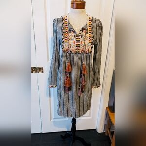 Chelsea and Theodore dress with embroidery and tassels